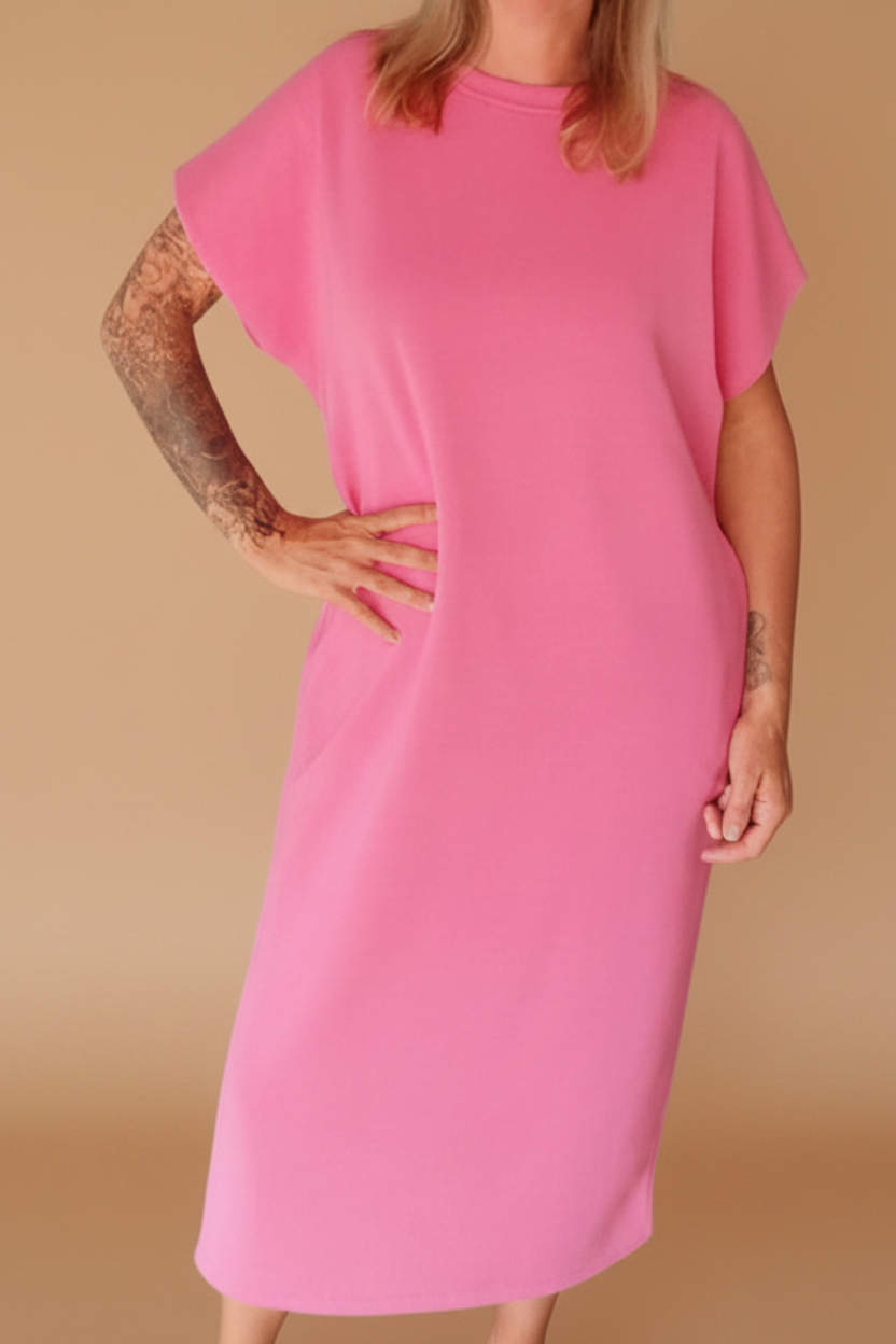 Boho-Luxe rosa Midikleid aus weichem Jersey für einen extravaganten Look.