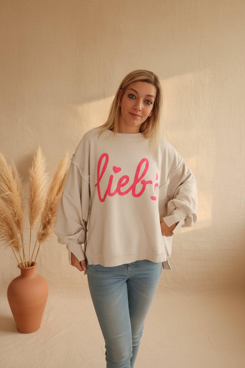 Lieb's Sweatshirt Damen – Frontansicht Saum aufgehalten pinker Schriftzug sichtbar