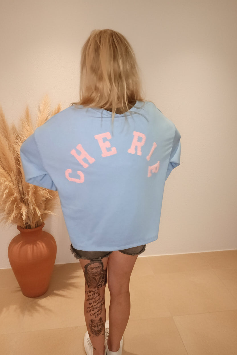 CHERIE Sweatshirt Hellblau Rückansicht – Rosa Schriftzug Oversized Damen